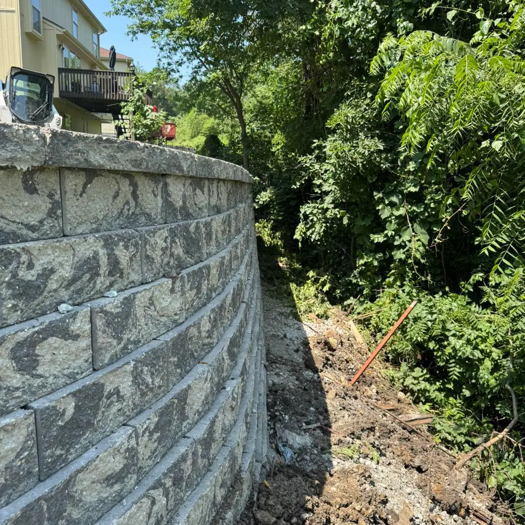 Completed retaining wall and site prep project by Simpson Excavation